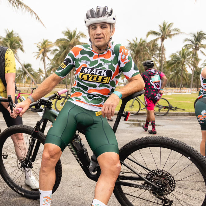 randy egues wearing the green goods by dax bib shorts that match the jersey